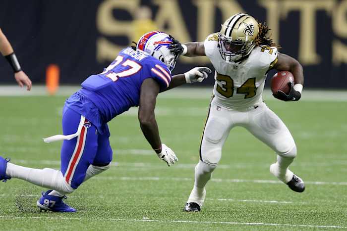 New Orleans Saints running back Tony Jones Jr. (34) is tackled by Buffalo Bills defensive end Mario Addison (97). Mandatory Credit: Chuck Cook-USA TODAY